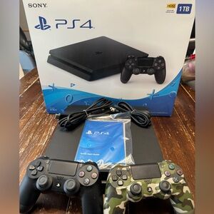 PlayStation 4!  Includes-box, power and HDMI cords, and two controllers